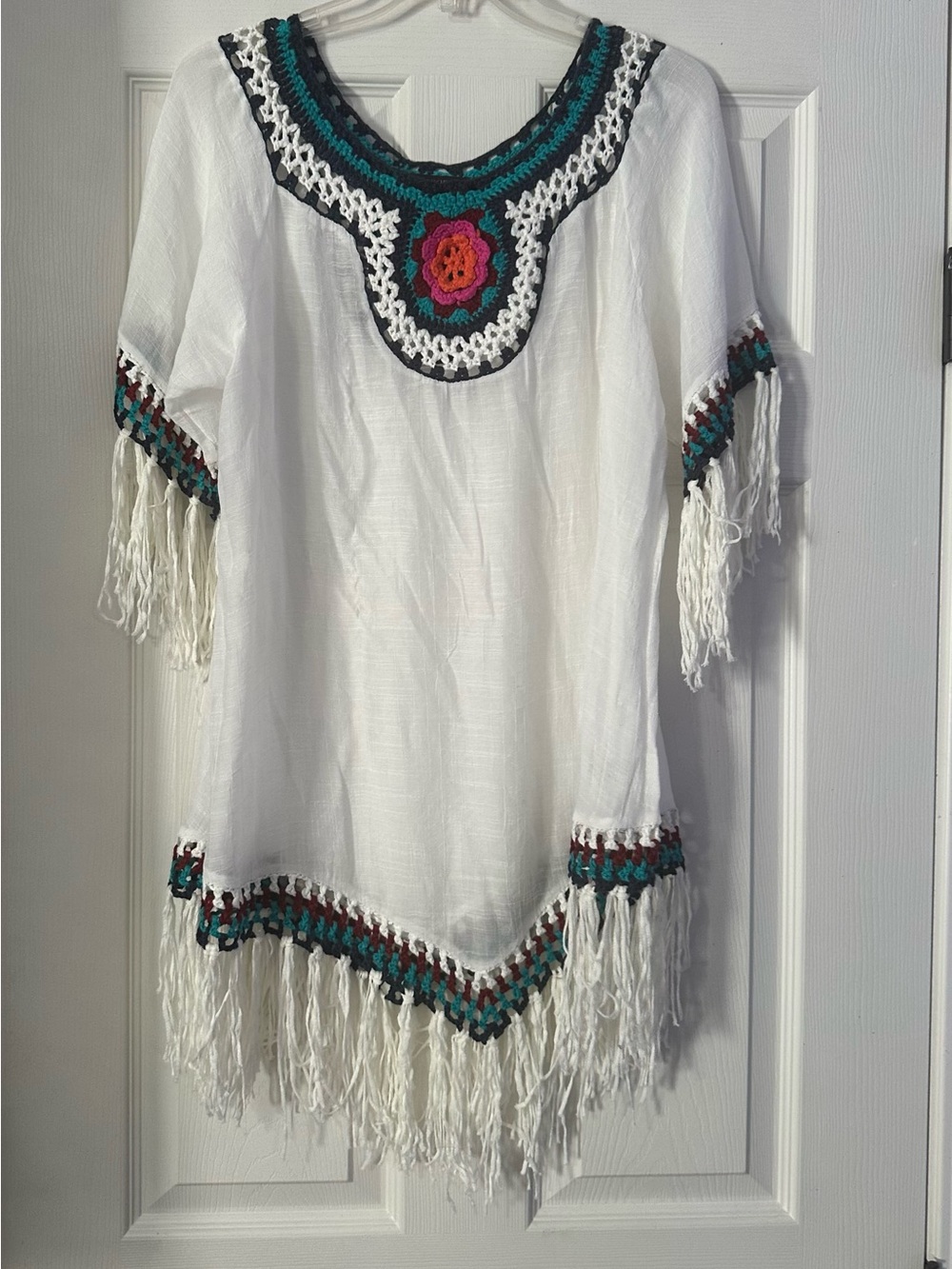 Boho White Crochet-Trim Fringe Tunic Top is a size Medium.